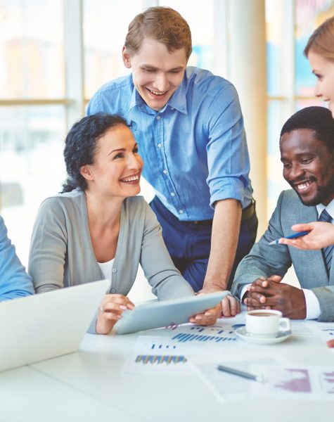 Group of business partners discussing strategies at meeting in office